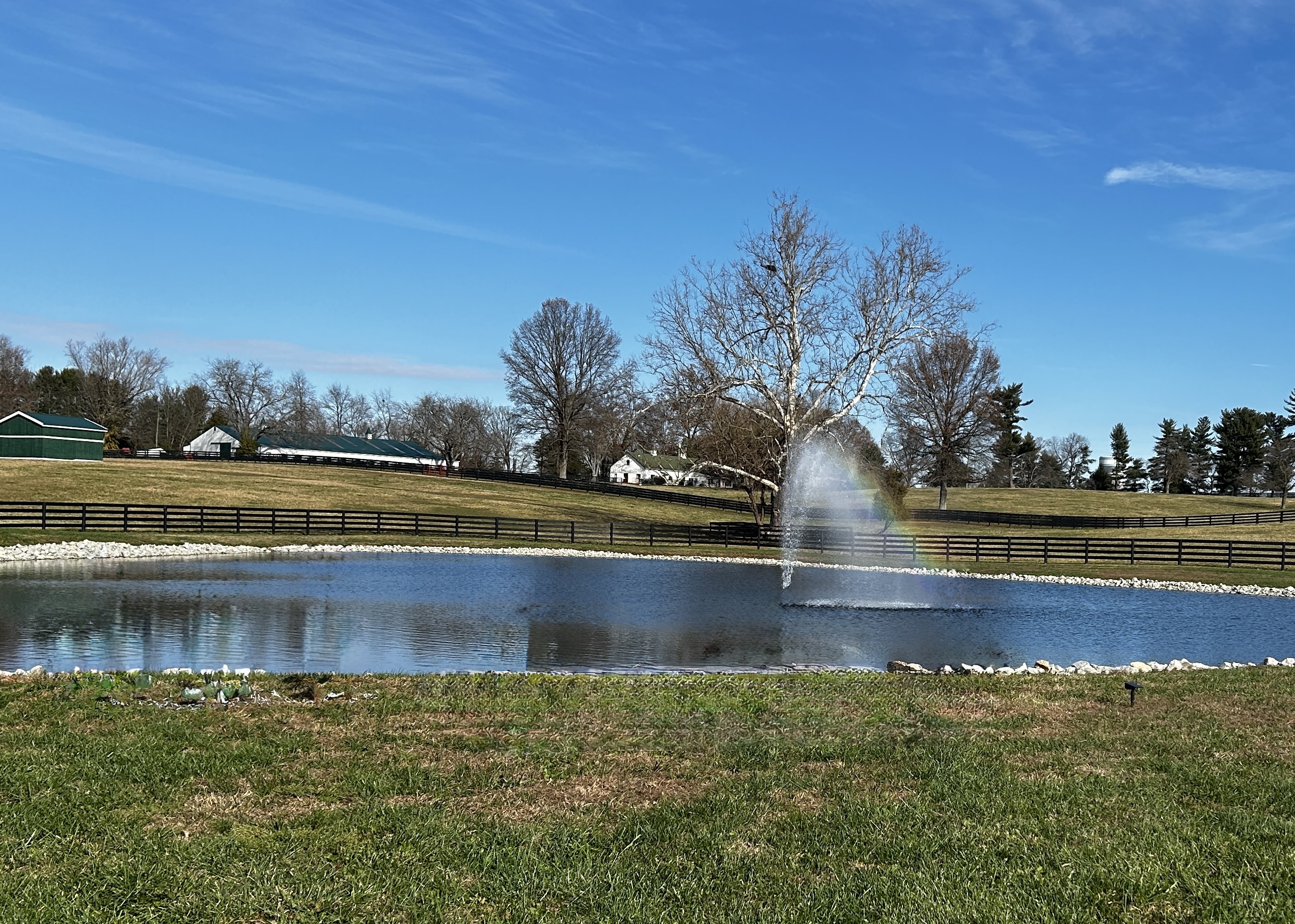 Kentucky farmland with pond and rolling green pastures